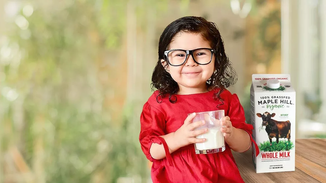Maple Hill milk with a young girl.