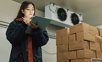 Woman monitoring warehouse Woman monitoring warehouse