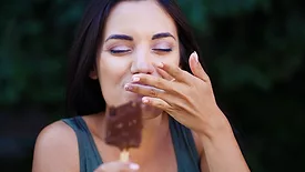 Woman eating an ice cream bar