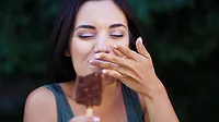 Woman eating an ice cream bar