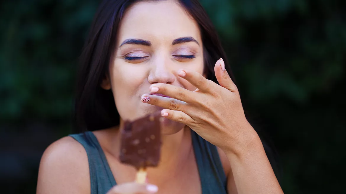 Woman eating an ice cream bar
