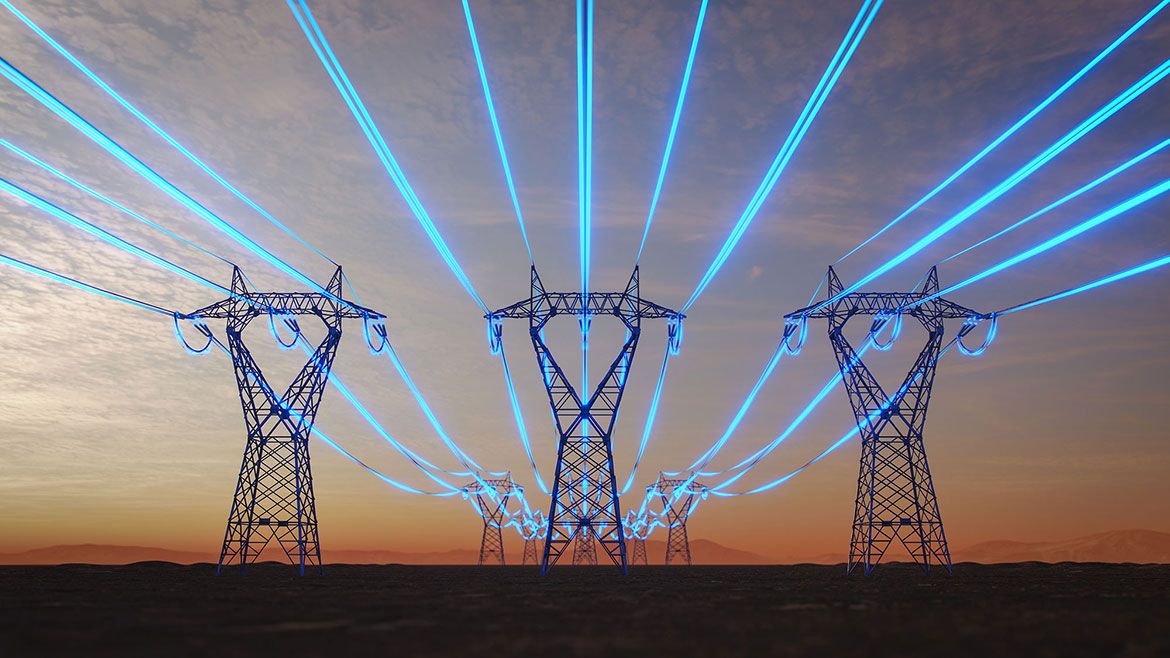 Three high voltage towers with glowing power lines to illustrate a surge.