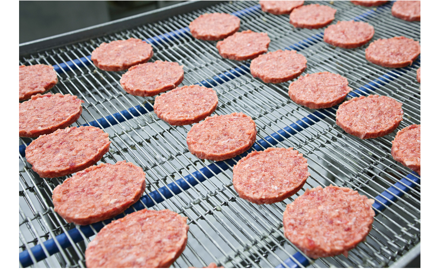 default frozen burger patties on conveyor