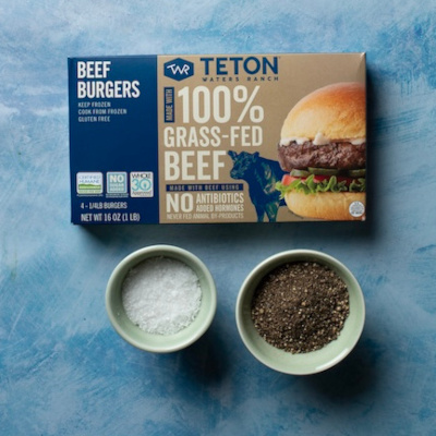 A package of Teton Waters Ranch 100% Grass-fed Beef next to small bowls of salt and pepper.