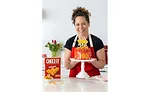 Celebrity Chef Stephanie Izzard Smiling Cheez-It Cake 100th Anniversary