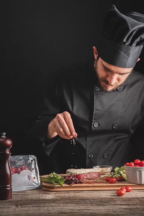 Chef Cooking with Cloud Nine Tomatoes ChefsBest Award