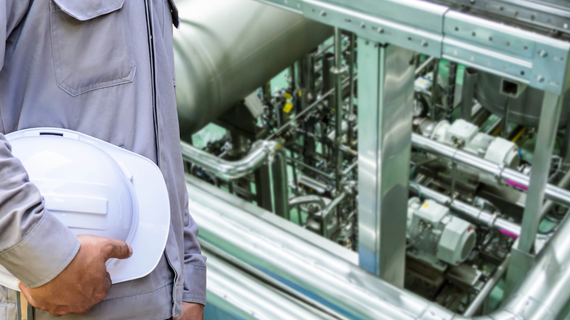 Cropped image of a Service Engineer repairing an ammonia refrigeration system.